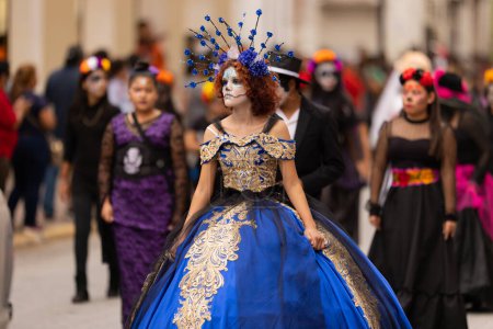Photo for Matamoros, Tamaulipas, Mexico - November 1, 2022: Dia de los Muertos Parade, Catrina wearing traditional clothing and flower head dress - Royalty Free Image