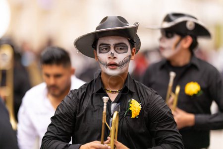 Photo for Matamoros, Tamaulipas, Mexico - November 1, 2022: Dia de los Muertos Parade, The Ricardo Flores Magon High School Marching Band performing at the parade - Royalty Free Image