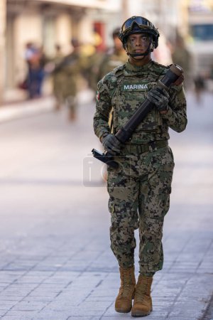 Photo for Matamoros, Tamaulipas, Mexico - September 16, 2022: Desfile 16 de Septiembre, Mexican Navy member handling a Mortar at the parade - Royalty Free Image
