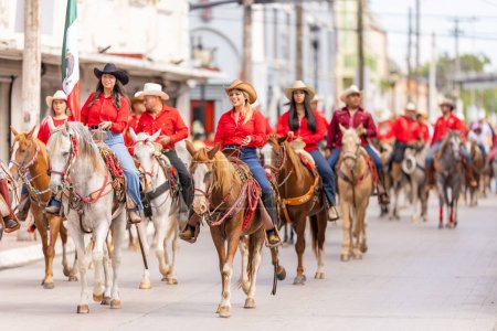 Photo for Matamoros, Tamaulipas, Mexico - September 16, 2022: Desfile 16 de Septiembre, Members of the Cuadra Cabalgantes de Matamoros riding their houses during the parade - Royalty Free Image