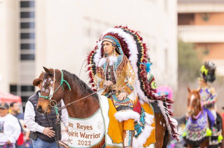 Photo for Laredo, Texas, USA - February 19, 2022: The Anheuser-Busch Washingtons Birthday Parade, Members of the Princess Pocachontas Council wearing traditional Native American Clothing, riding horses - Royalty Free Image