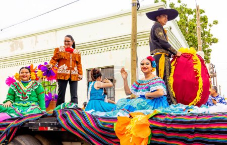 Photo for Matamoros, Tamaulipas, Mexico - February 25, 2023: Fiestas Mexicanas Parade, Students from TEC, wearing traditional Mexican clothing, riding a float at the parade - Royalty Free Image