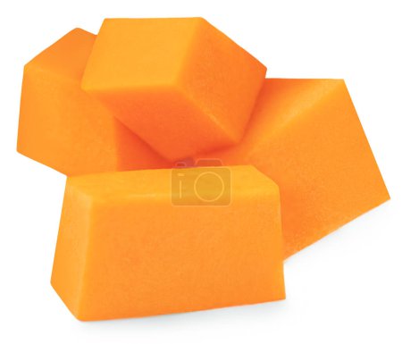 Foto de Pumpkin squash slices isolated on white background. Pumpkin pieces cutted in a cubes close up - Imagen libre de derechos