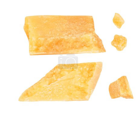 Téléchargez les photos : Pieces of parmesan cheese isolated on white background. Hard mature cheese Parmesan, Parmigiano in rough cubes top view, flat lay - en image libre de droit