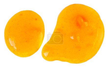Foto de Orange fruit  jam isolated on white background, top view. Orange or tangerine spread  Flat la - Imagen libre de derechos