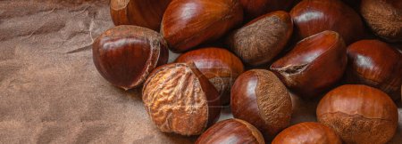 Photo for Sweet Chestnuts Top view. Copyspace. Pile of ripe chestnuts for food background - Royalty Free Image