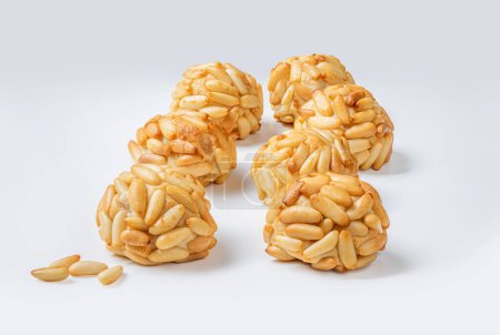 Photo for Panellets pine nuts close up. Typical Catalan dessert panellets of All Saints holiday, known as Castanyada - Royalty Free Image