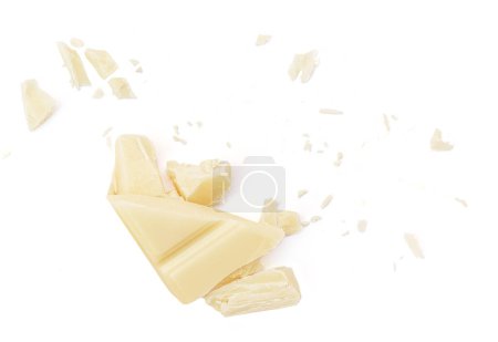 Photo for White milk chocolate chunks isolated on white background. Flying Chocolate pieces explosion, shavings and cocoa crumbs Top view. Flat la - Royalty Free Image