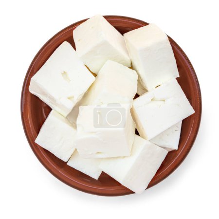 Photo for Bowl with Feta cheese isolated on white background. Fresh Greek feta cheese cubes top view. Flat la - Royalty Free Image
