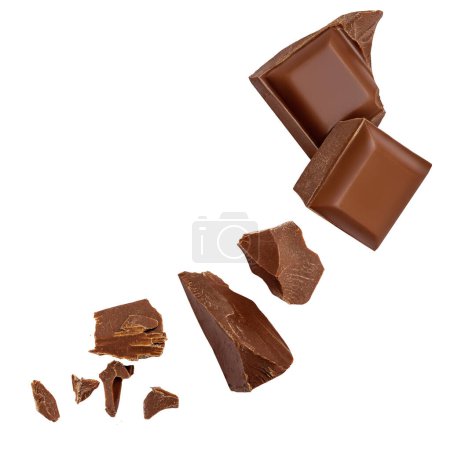 Photo for Milk chocolate chunks isolated on white background. Crumbs, shavings and Flying Chocolate pieces Top view. - Royalty Free Image
