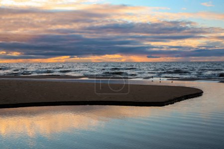 Photo for Sandy beach during autumn sunset in the town Saulkrasti located near the capital Riga - Royalty Free Image