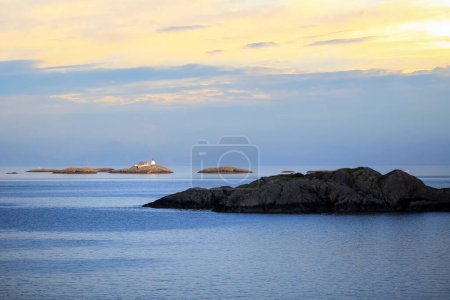 Photo for Midsummer sunlight  on the sky in the fjord Vestfjorden near the Lofoten islands and town Svolvaer, Norway - Royalty Free Image