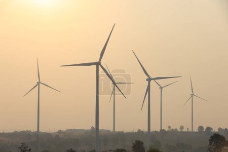 Silhouette wind turbine farm against sunrise sky, Sustainable and renewable energy