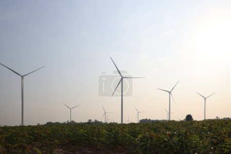 Silhouette wind turbine farm against sunrise sky, Sustainable and renewable energy