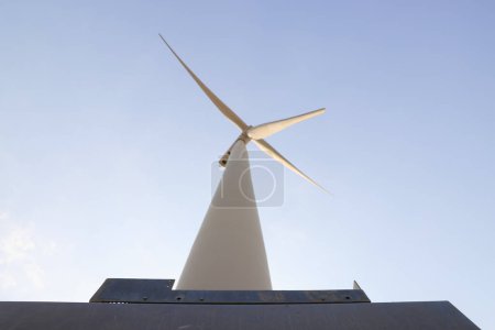 Bottom up view of Wind Turbines Windmill Energy Farm