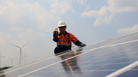asian engineer woman working with solar panels in the city