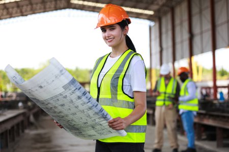 Photo for Female Civil engineer works with colleagues at precise factory - Royalty Free Image