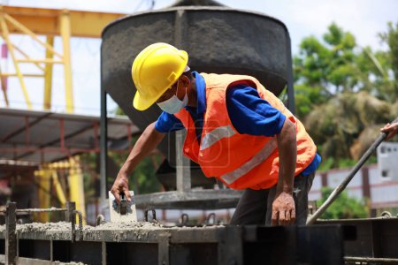 Construction labor or worker make concrete casting process
