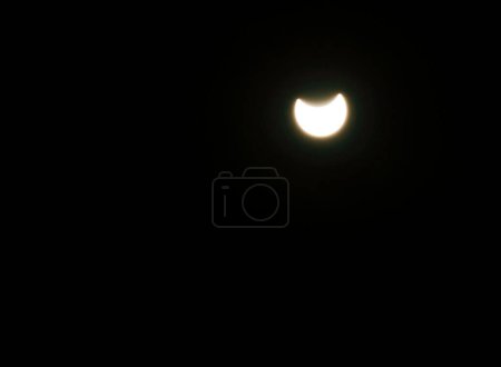 Photo for Partial solar eclipse that occurred on Tuesday, October 25 could be observed in many areas. - Royalty Free Image