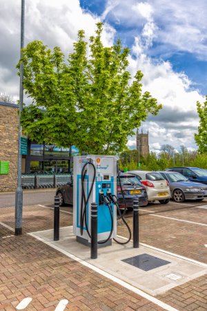 Photo for Public Electric Vehicle charging points in supermarket car park, Chipping Sodbury South Gloucestershire, United Kingdom - Royalty Free Image