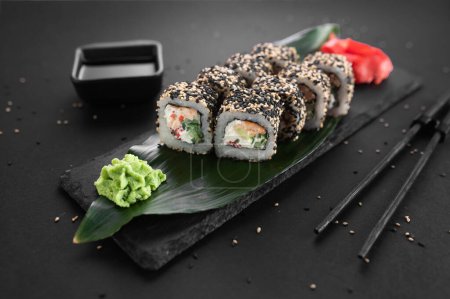 California sake roll with salmon, avocado and sesame. Traditional Japanese cuisine