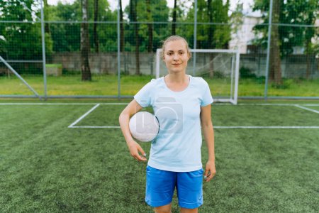 Photo for Portrait of a football player girl with a ball. football - Royalty Free Image