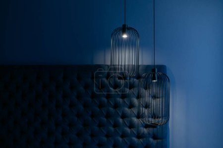 Photo for Pendant ceiling lamp in vintage style. Blue bedroom interior. metal lamp in the bedroom. evening in the bedroom - Royalty Free Image