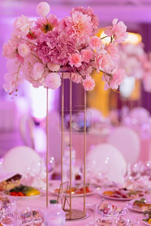 Photo for Luxury wedding table with beautiful flowers. pink stylized. banquet hall for a wedding. - Royalty Free Image