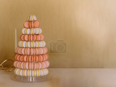 Photo for Colorful macarons on pyramid-shaped plastic stand on many visible levels. place for text - Royalty Free Image