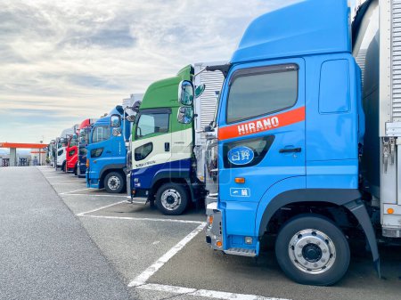 Photo for Kanakawa Japan - 19 Oct 2023: Lot of trucks at EXPASA Ebina Service Area, EXPASA service area for drivers to take a toilet, coffee break, fill up the tank and eat food. - Royalty Free Image