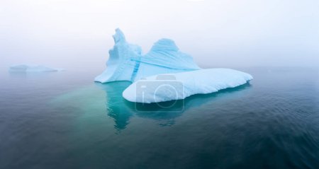 Photo for Glaciers drone aerial image from above - climate change and global warming. Glaciers from a melting iceberg in Ilulissat, Greenland. The icy landscape of the Arctic nature in the UNESCO world - Royalty Free Image