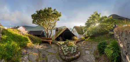Photo for Houses with turf roofs, Bour village, vagar island, faroe islands, denmark, europe .Sunny summer view of Saksun village with typical turf-top houses. Traveling concept background. - Royalty Free Image