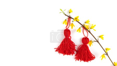 Photo for Red tassel Baba Marta symbol Martenitsa on white card on red background. International Martisor day celebrate spring arrival. Greetting card copy space - Royalty Free Image