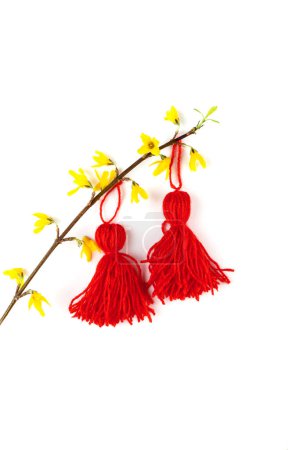 Photo for Red tassel Baba Marta symbol Martenitsa on white card on red background. International Martisor day celebrate spring arrival. Greetting card copy space - Royalty Free Image
