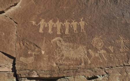 Native American petroglyphs on the cliff on the Poison Spider trail near Moab, Utah, USA