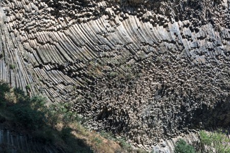 Columnar jointing in the Armenian Garni Gorge. Cliff walls of well preserved basalt columns. Caucasus region.