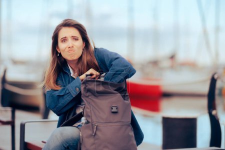 Photo for Tourist Checking Her Backpack Not Finding Important Documents - Royalty Free Image
