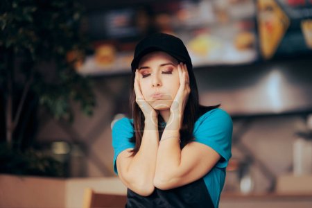 Téléchargez les photos : Stressed Fast Food Employee Feeling Desperate and Frustrated - en image libre de droit