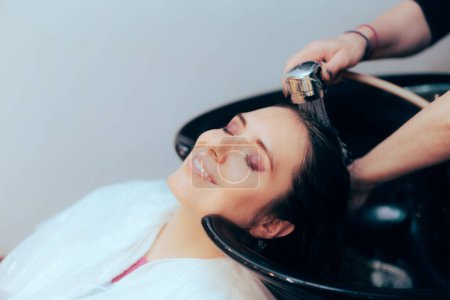 Photo for Happy Woman Having her Hair Washed in a Professional Salon - Royalty Free Image