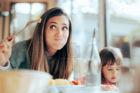 Photo for Funny Mom Inspecting the Food in a Restaurant for its Freshness - Royalty Free Image