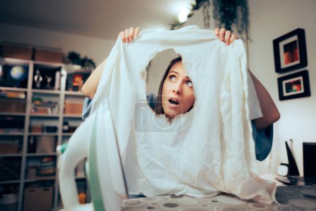 Photo for Funny Woman Failing in Ironing a White Shit Making Mistakes - Royalty Free Image