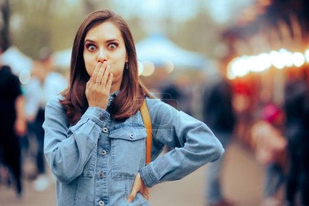 Photo for Woman feeling Sick Covering her Mouth at Local Funfair - Royalty Free Image