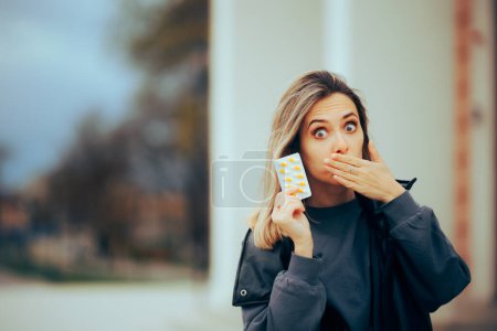 Photo for Woman Covering her Mouth Showing Vitamin Pills Tablet - Royalty Free Image