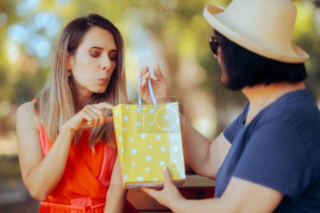 Photo for Woman Checking the Present She Receives from her Mother - Royalty Free Image