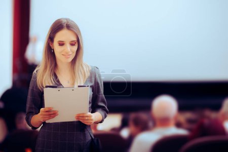 Photo for Happy Woman Holding a Clipboard Attending a Conference - Royalty Free Image