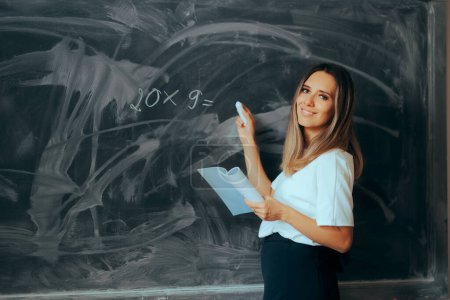 Math Teacher Writing a Simple Exercise on a Blackboard 