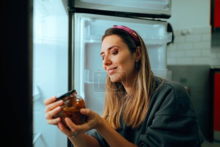 Woman Checking the Expiration Date on a Mushroom Jar 