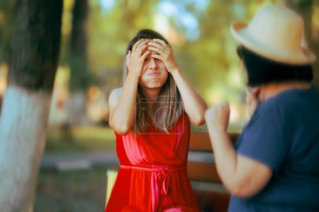 Photo for Exasperated Daughter Fighting with her Mother in the Park - Royalty Free Image