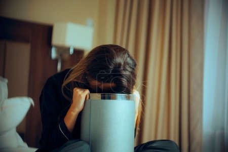 Sick Woman Vomiting into a Trash Bin at Home 