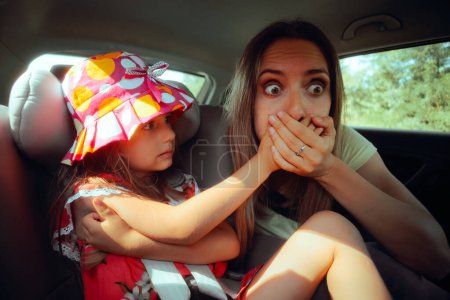 Photo for Mom Suffering from Car Sick Traveling in the Back Seat - Royalty Free Image